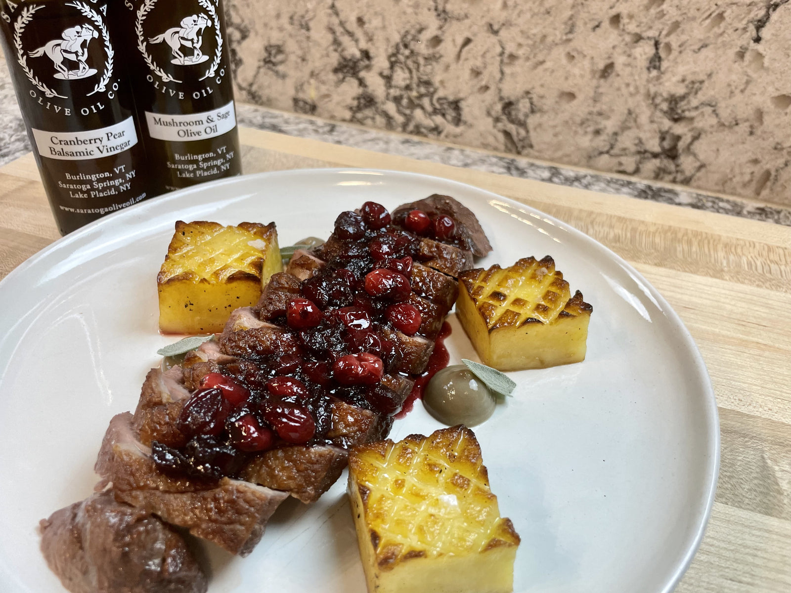 Duck Breast with Cranberry Sauce, Pommes Fondant, and a Mushroom Gel