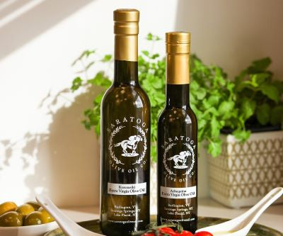 Two bottles of Extra virgin olive oil evoo