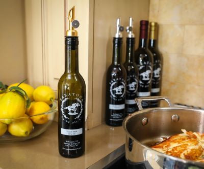 Five bottles of Saratoga Olive Oil Co olive oil and balsamic vinegar