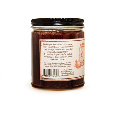 a jar of strawberry pepper balsamic jam from the side view